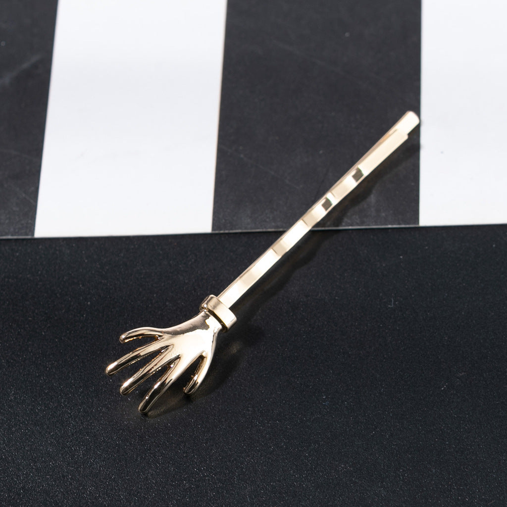 Wholesale Glossy Little Hand Skull Alloy Hair Clips